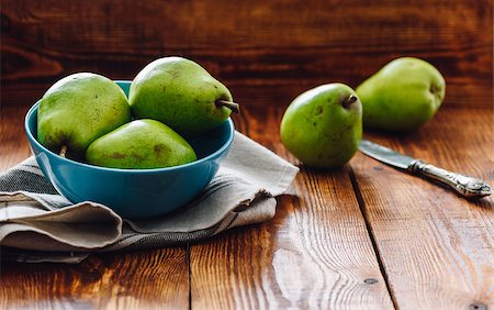 seva_blsv (artist) - Green Pears in Blue Bowl and Some Pears on Background with Knife. Stock Photo - Budget Royalty-Free & Subscription, Code: 400-09008496
