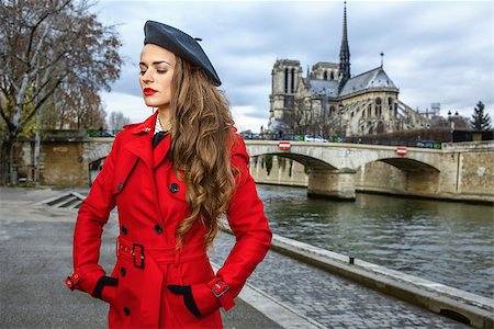 simsearch:400-09031587,k - Bright in Paris. elegant traveller woman in red trench coat on embankment near Notre Dame de Paris in Paris, France Stock Photo - Budget Royalty-Free & Subscription, Code: 400-09008762