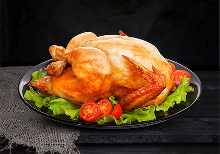 simsearch:400-05357993,k - Roasted chicken on black background with lettuce and tomatoes Foto de stock - Super Valor sin royalties y Suscripción, Código: 400-09008884