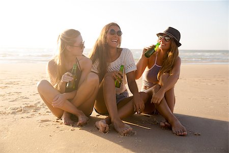 sunset drinking beer - Best friends having fun on the beach Stock Photo - Budget Royalty-Free & Subscription, Code: 400-09009193