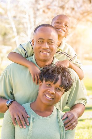 Beautiful Happy African American Family Portrait Outdoors At The Park. Photographie de stock - Aubaine LD & Abonnement, Code: 400-09009222