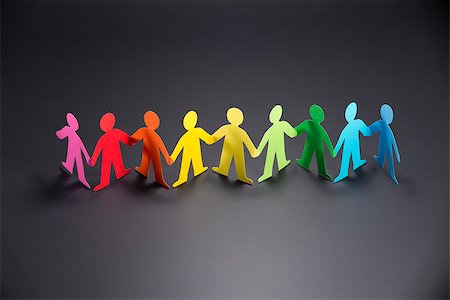 paper cutout chain - people origami out of colored paper holding hands Stock Photo - Budget Royalty-Free & Subscription, Code: 400-09009494
