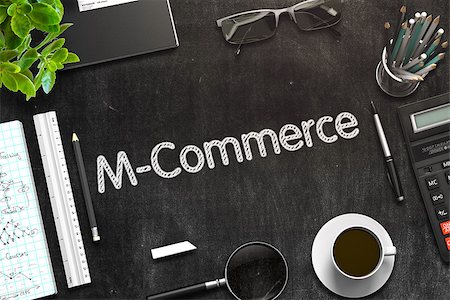 M-Commerce Handwritten on Black Chalkboard. Top View of Black Office Desk with a Lot of Business and Office Supplies on It. 3d Rendering. Toned Image. Stock Photo - Budget Royalty-Free & Subscription, Code: 400-09009666