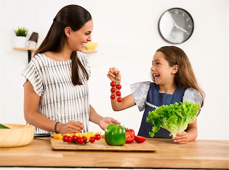 Shot of a mother and daughter having fun in the kitchen Stock Photo - Budget Royalty-Free & Subscription, Code: 400-09009888