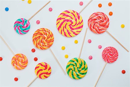 pastel color lollipop candy - Pattern sweet lollipops, candy on white background, top view flat lay. Minimal concept holiday decoration, birthday party, food background Stock Photo - Budget Royalty-Free & Subscription, Code: 400-09019016