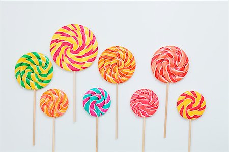 pastel color lollipop candy - Lollipop candy caramel on sticks on white. Food background. Copy space Stock Photo - Budget Royalty-Free & Subscription, Code: 400-09019017