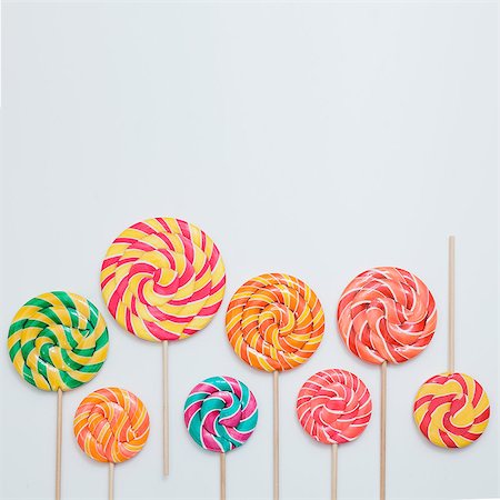 pastel color lollipop candy - Think differ concept. Lollipop sweet caramel candy copy space white background colorful birthday party square. Lay flat top view Stock Photo - Budget Royalty-Free & Subscription, Code: 400-09019018