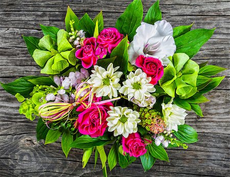 vintage wedding bouquet with roses and white gerberas on old wooden boards, view from above Stock Photo - Budget Royalty-Free & Subscription, Code: 400-09019019