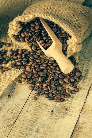 simsearch:400-05371796,k - Coffee beans on old fashioned wooden table. Stock Photo - Budget Royalty-Free & Subscription, Code: 400-09019106