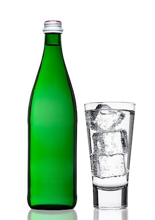 simsearch:400-06796544,k - Green bottle of sparkling mineral water with glass nd ice cubes on white background Stock Photo - Budget Royalty-Free & Subscription, Code: 400-09019118