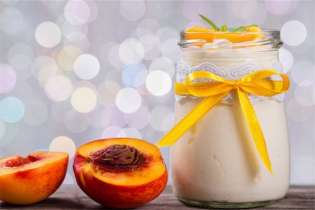 yogurt with peaches, bokeh background, closeup Stock Photo - Budget Royalty-Free & Subscription, Code: 400-09019364