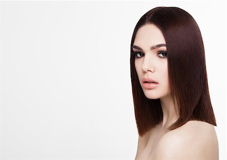 simsearch:400-06790945,k - Beauty portrait model with shiny brown hairstyle with pink lips on white background Photographie de stock - Aubaine LD & Abonnement, Code: 400-09019360
