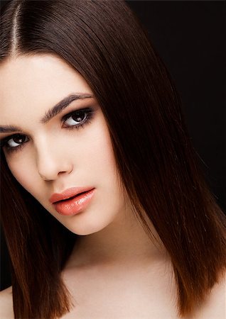 simsearch:400-06179308,k - Beauty portrait model with shiny brown hairstyle with pink lips on black background Stock Photo - Budget Royalty-Free & Subscription, Code: 400-09019528
