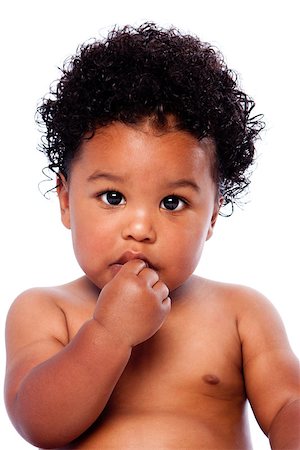 Cute adorable beautiful baby toddler face with hand in mouth and innocent expression and curly hair. Foto de stock - Super Valor sin royalties y Suscripción, Código: 400-09019606