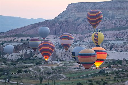 evrenkalinbacak (artist) - Hot Air Balloons in Cappadocia Valleys, Turkey Stockbilder - Microstock & Abonnement, Bildnummer: 400-09019652