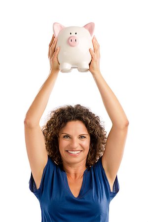 Portrait of a happy middle aged woman holding a Piggybank over her head Stock Photo - Budget Royalty-Free & Subscription, Code: 400-09010306