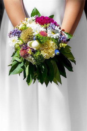 first communion - Woman/girl in white dress holding flowers at wedding/first holy communion. Stock Photo - Budget Royalty-Free & Subscription, Code: 400-09010923