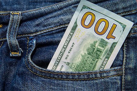 One hundred American dollars bill in the pocket of blue jeans Stockbilder - Microstock & Abonnement, Bildnummer: 400-09011032