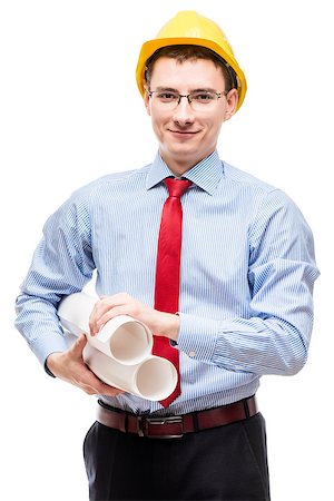 simsearch:400-06098950,k - Young architect in a shirt wearing a yellow hard hat, portrait on a white background Photographie de stock - Aubaine LD & Abonnement, Code: 400-09011051