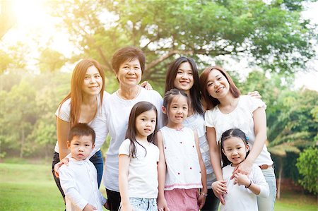 Group of happy Asian multi generations family portrait, grandparent, parent and children, outdoor nature park in morning with sun flare. Stock Photo - Budget Royalty-Free & Subscription, Code: 400-09028567