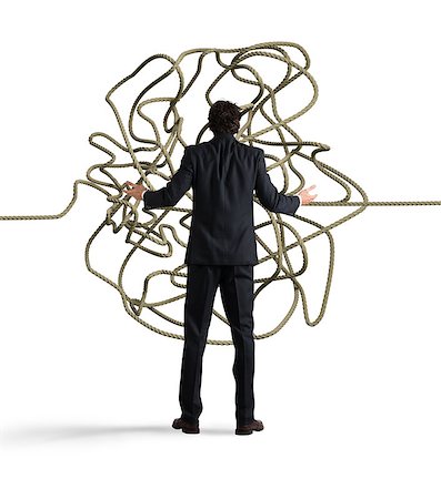 simsearch:400-04611529,k - Businessman looks confused tangle of rope. Find a solution concept Photographie de stock - Aubaine LD & Abonnement, Code: 400-09028679