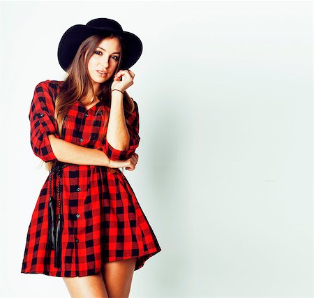 young pretty brunette girl hipster in hat on white background casual close up dreaming smiling, lifestyle real people concept Stock Photo - Budget Royalty-Free & Subscription, Code: 400-09028693