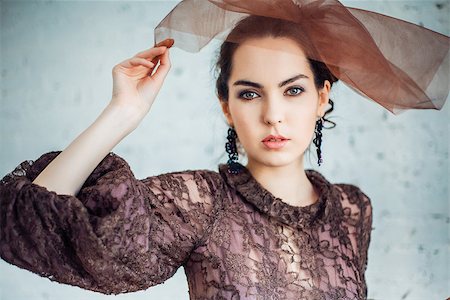 simsearch:400-05164576,k - Retro portrait of a beautiful woman. Vintage style. Professional make-up and hairstyle. Fashion photo Stock Photo - Budget Royalty-Free & Subscription, Code: 400-09028827