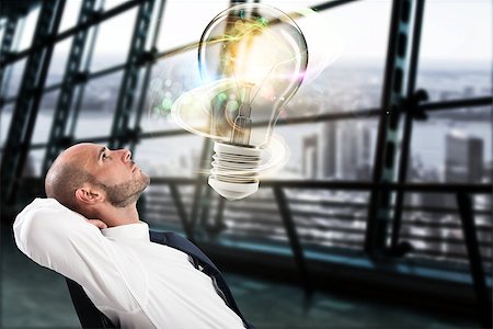 simsearch:640-01354128,k - Businessman looks a big light bulb in his office. Great business idea concept Photographie de stock - Aubaine LD & Abonnement, Code: 400-09029103