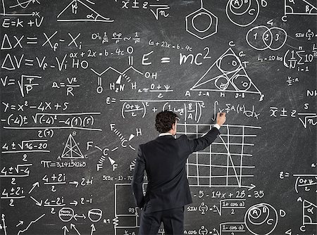 simsearch:695-03378508,k - Businessman trying to solve problems with Math calculations on the blackboard Stock Photo - Budget Royalty-Free & Subscription, Code: 400-09029124