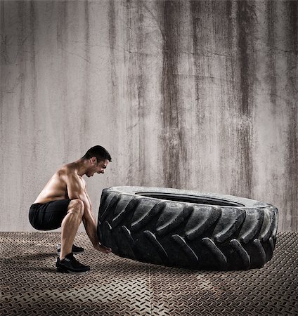 simsearch:400-08505882,k - Athletic muscular man raises a big tire Stock Photo - Budget Royalty-Free & Subscription, Code: 400-09029211