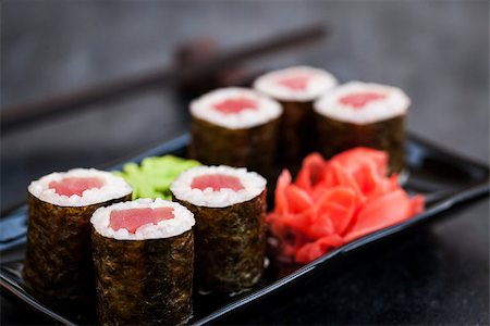 simsearch:400-04292843,k - Fresh delicious tuna maki sushi rolls on dark background, japanese food Stock Photo - Budget Royalty-Free & Subscription, Code: 400-09029385