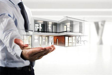 simsearch:400-06098950,k - Businessman showing a modern office project in hand Photographie de stock - Aubaine LD & Abonnement, Code: 400-09029619