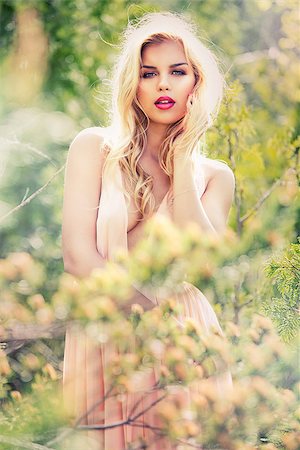 simsearch:400-04821060,k - beautiful woman with pretty makeup and pink lipstick posing outdoors wearing spring and summer dress Photographie de stock - Aubaine LD & Abonnement, Code: 400-09029717