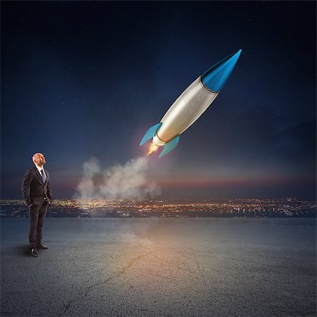 simsearch:400-09112433,k - Businessman looks start a missile in the sky. Concept of company startup and new business. 3D Rendering. Stockbilder - Microstock & Abonnement, Bildnummer: 400-09030067