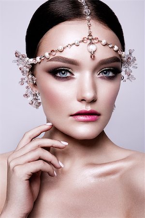 simsearch:400-04863868,k - Portrait of a beautiful fashion brunette bride, sweet and sensual. Wedding make up and hair. Wight background. Art modern style. Blue eyes. Stock Photo - Budget Royalty-Free & Subscription, Code: 400-09030116