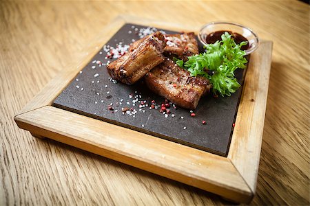 pork belly ribs - Pork breast on rib. Served with barbecue sauce Stock Photo - Budget Royalty-Free & Subscription, Code: 400-09030217