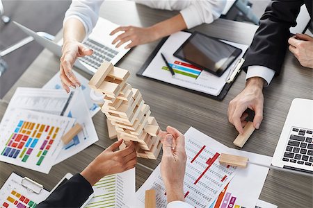 simsearch:400-08669915,k - Team of business people in office build a wooden construction. concept of teamwork and partnership Stock Photo - Budget Royalty-Free & Subscription, Code: 400-09030360