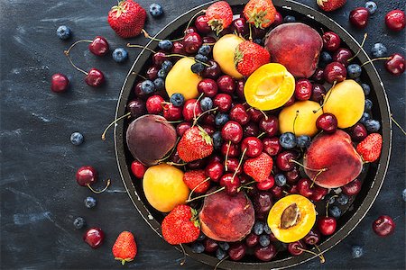 rustic tray - Fresh ripe summer berries and fruits (peaches, apricots, cherries and strawberries) on tray Stock Photo - Budget Royalty-Free & Subscription, Code: 400-09030616