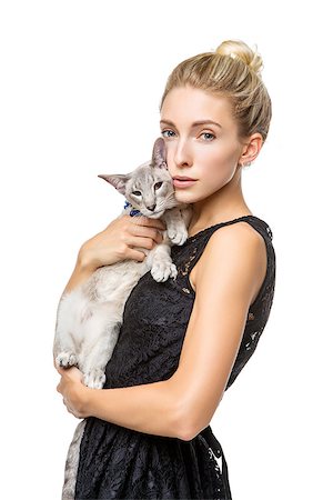 simsearch:649-07065153,k - Beautiful blond girl with oriental siam cat isolated on white background. Copy space. Photographie de stock - Aubaine LD & Abonnement, Code: 400-09030778