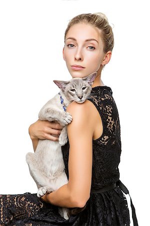 simsearch:649-07065153,k - Beautiful blond girl with oriental siam cat isolated on white background. Copy space. Photographie de stock - Aubaine LD & Abonnement, Code: 400-09030773