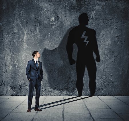 shadow hero - Businessman with his shadow of big super hero on the wall. Concept of powerful man Stock Photo - Budget Royalty-Free & Subscription, Code: 400-09030949