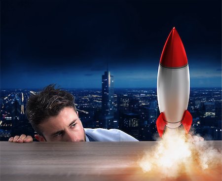 simsearch:400-08575298,k - Businessman holding a small rocket. Startup of a new company concept Stock Photo - Budget Royalty-Free & Subscription, Code: 400-09031146