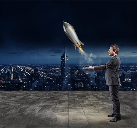 simsearch:400-09112433,k - Businessman throws a rocket in the sky. Startup of a new company concept Stockbilder - Microstock & Abonnement, Bildnummer: 400-09031186