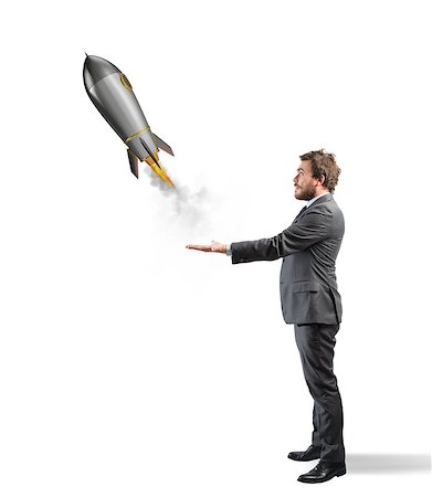 simsearch:400-09112433,k - Businessman holding a small rocket. Startup of a new company concept Stockbilder - Microstock & Abonnement, Bildnummer: 400-09031472