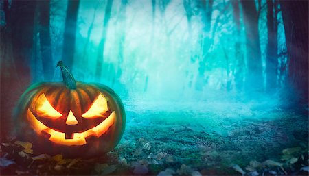 Halloween background. Spooky forest with dead trees and pumpkin.Halloween design with pumpkin Stock Photo - Budget Royalty-Free & Subscription, Code: 400-09031640