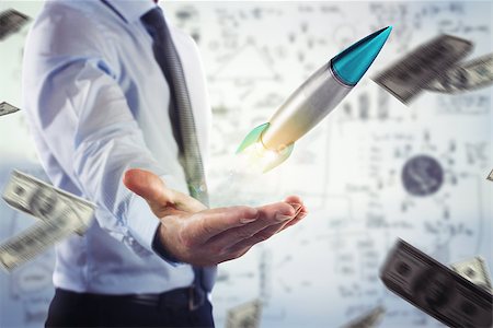 simsearch:400-08575298,k - Businessman holding a small rocket. Startup working enterprise concept Stock Photo - Budget Royalty-Free & Subscription, Code: 400-09031665