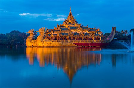 fyletto (artist) - Golden Karaweik palace on Kandawgyi lake looks like an ancient royal barge. Twilight time. Yangon, Myanmar Stock Photo - Budget Royalty-Free & Subscription, Code: 400-09031847