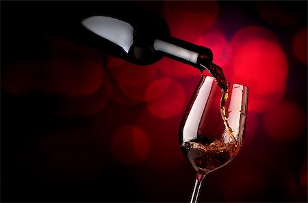 simsearch:400-04264239,k - Wine pouring in wineglass on a vinous background Stock Photo - Budget Royalty-Free & Subscription, Code: 400-09031900