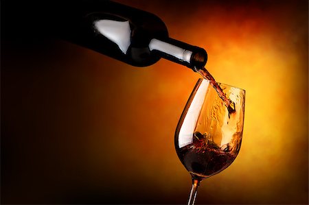 simsearch:400-04919991,k - Red wine pouring in a wineglass on orange background Foto de stock - Royalty-Free Super Valor e Assinatura, Número: 400-09031901