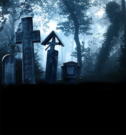 foggy creepy pictures - Medieval stone crosses and tombstones in a cemetery in a misty forest. Photo toned in blue color. Copy space for your text Stock Photo - Budget Royalty-Free & Subscription, Code: 400-09031999